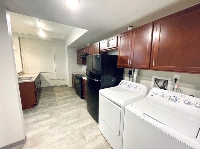 Kitchen + Laundry - Legacy Place Monument Square Apartments