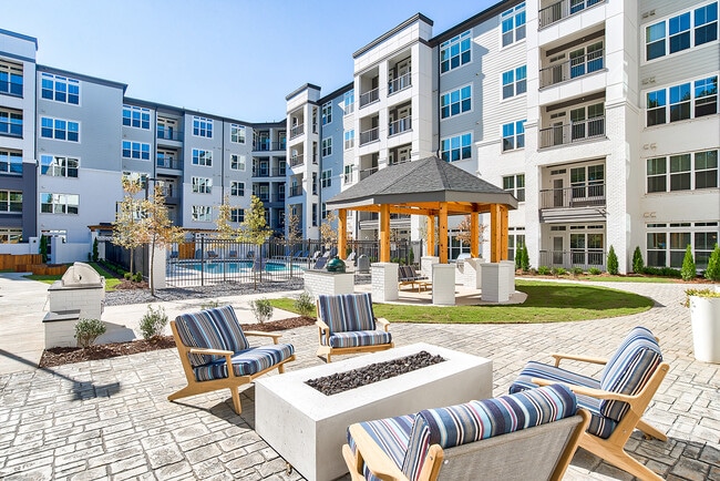 Fire Pit and Outdoor TV Pavilion - EVOQ TOWN FLATS AT JOHNS CREEK Apartments