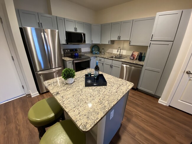 1 BR, 1BA Den -730 SF-Kitchen - Bella Vita Senior Living Apartments