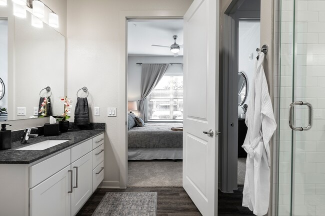 Granite Countertops & Walk-In Tiled Showers - Overture River District 55+ Active Adult A... Apartments
