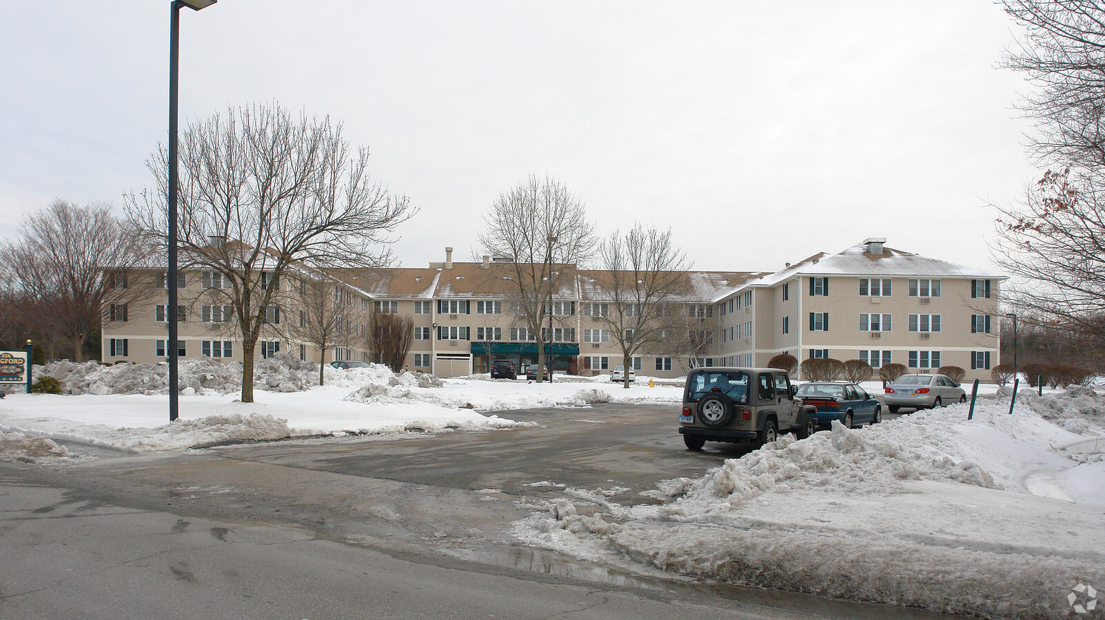 3/4 view is impossible due to building size and surrounding trees - Torringford West Apartments