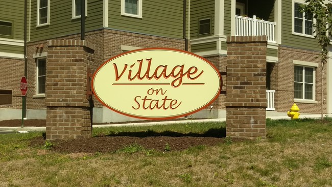 Street Sign - Village on State Apartments