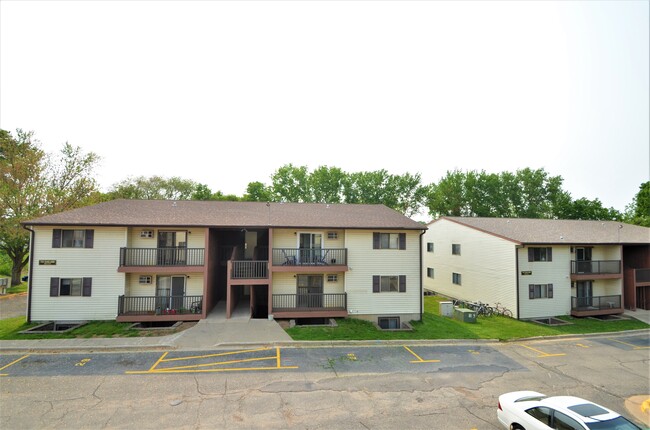 Exterior featuring balconies - Oakland Village Apartments